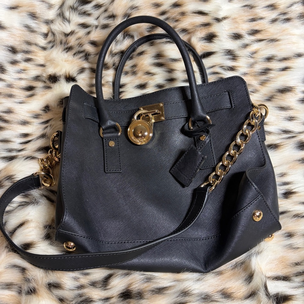 Elegant Black Leather Handbag with Gold Accents